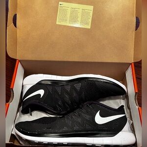 New In Box:  Nike Free 5.0 Men’s Size 13 Black and White Tennis Shoes.